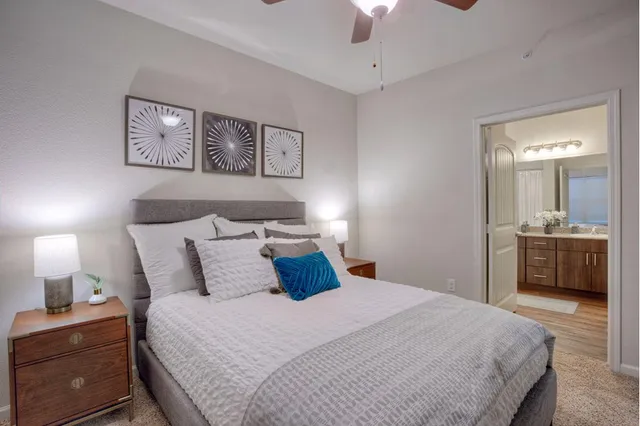 a bedroom with a bed and a view of bathroom