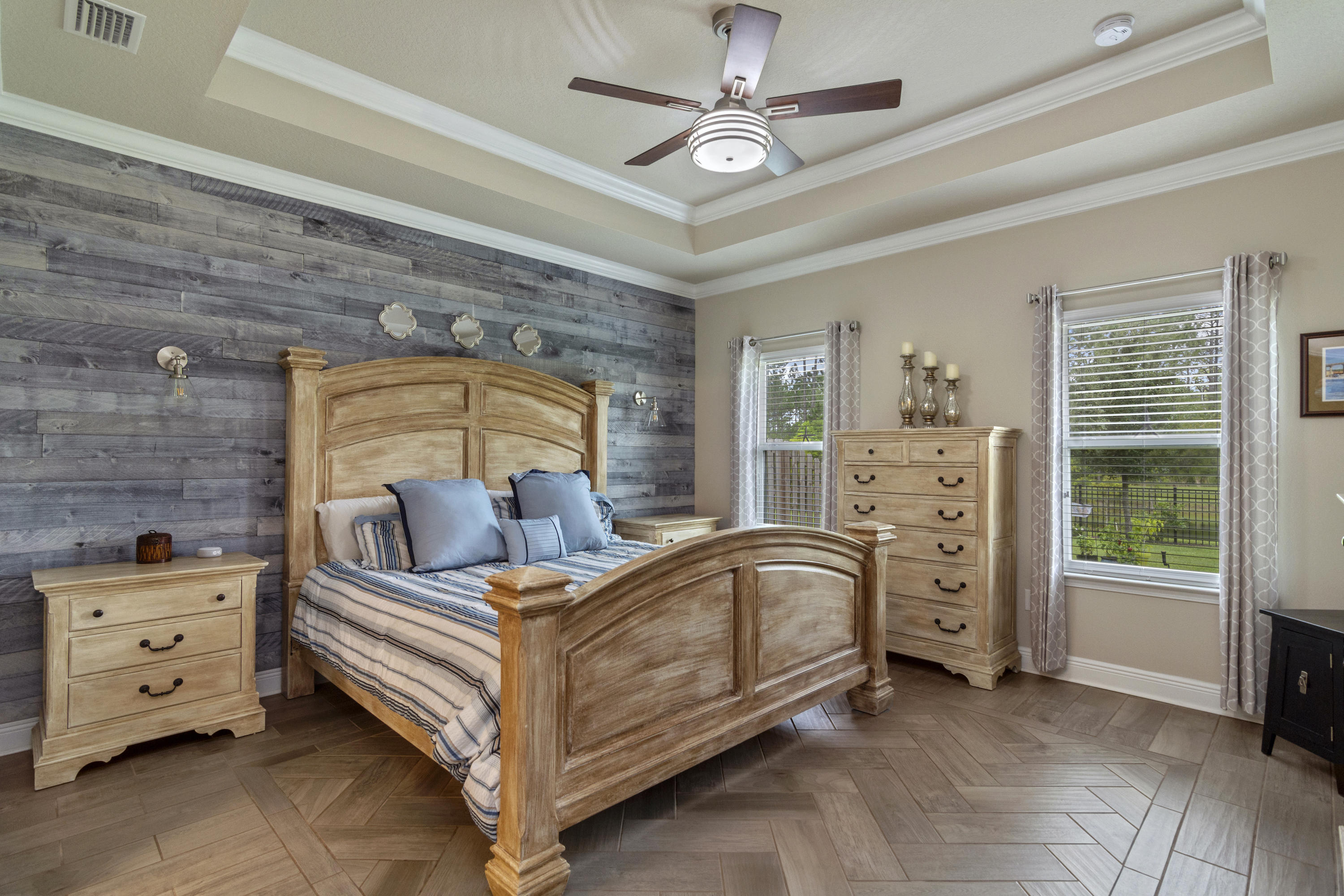 341 Lilly Bell Lane Freeport, FL 32439 - Photo 16 of 36 a bedroom with a bed and a chandelier