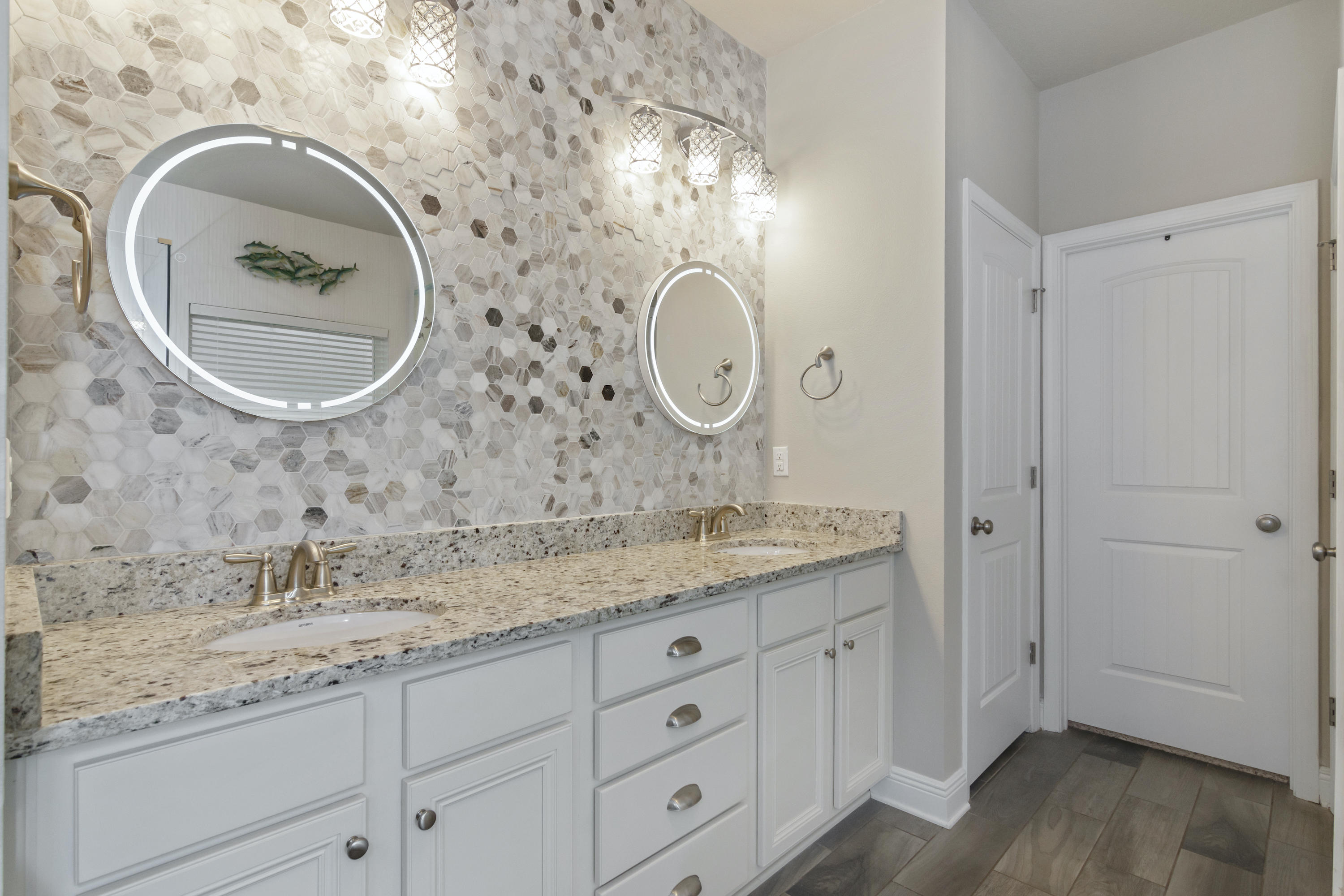 341 Lilly Bell Lane Freeport, FL 32439 - Photo 18 of 36 a bathroom with a granite countertop double vanity sink and a mirror