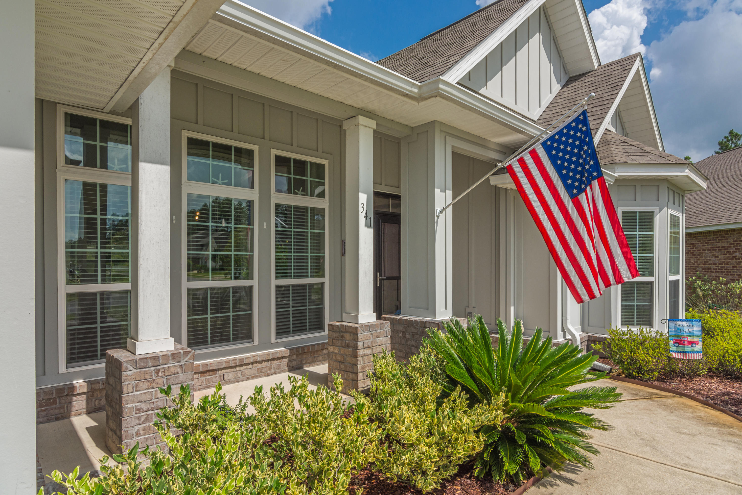 341 Lilly Bell Lane Freeport, FL 32439 - Photo 3 of 36 a front view of a house with a yard