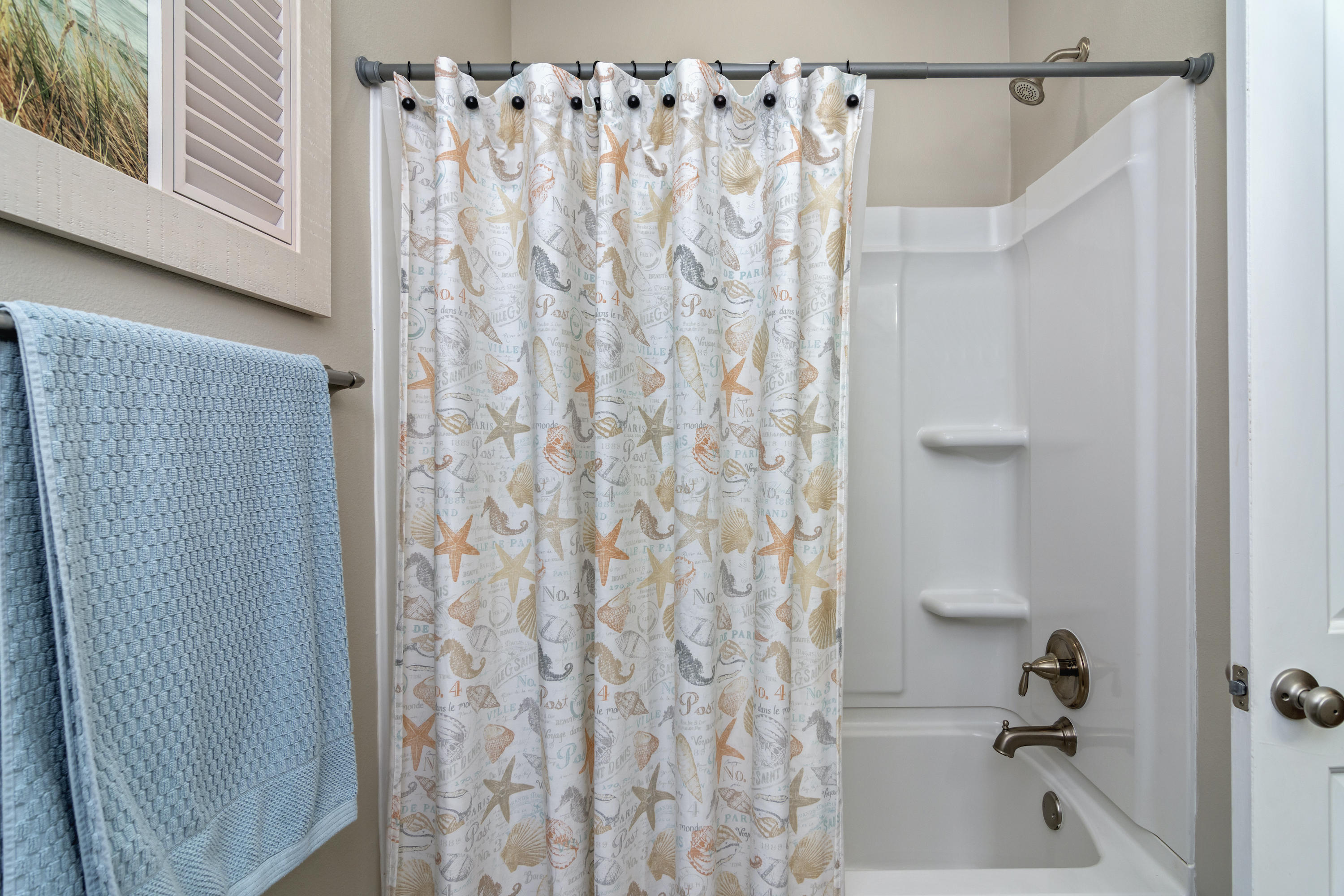 341 Lilly Bell Lane Freeport, FL 32439 - Photo 25 of 36 a bathroom with a shower curtain and a sink