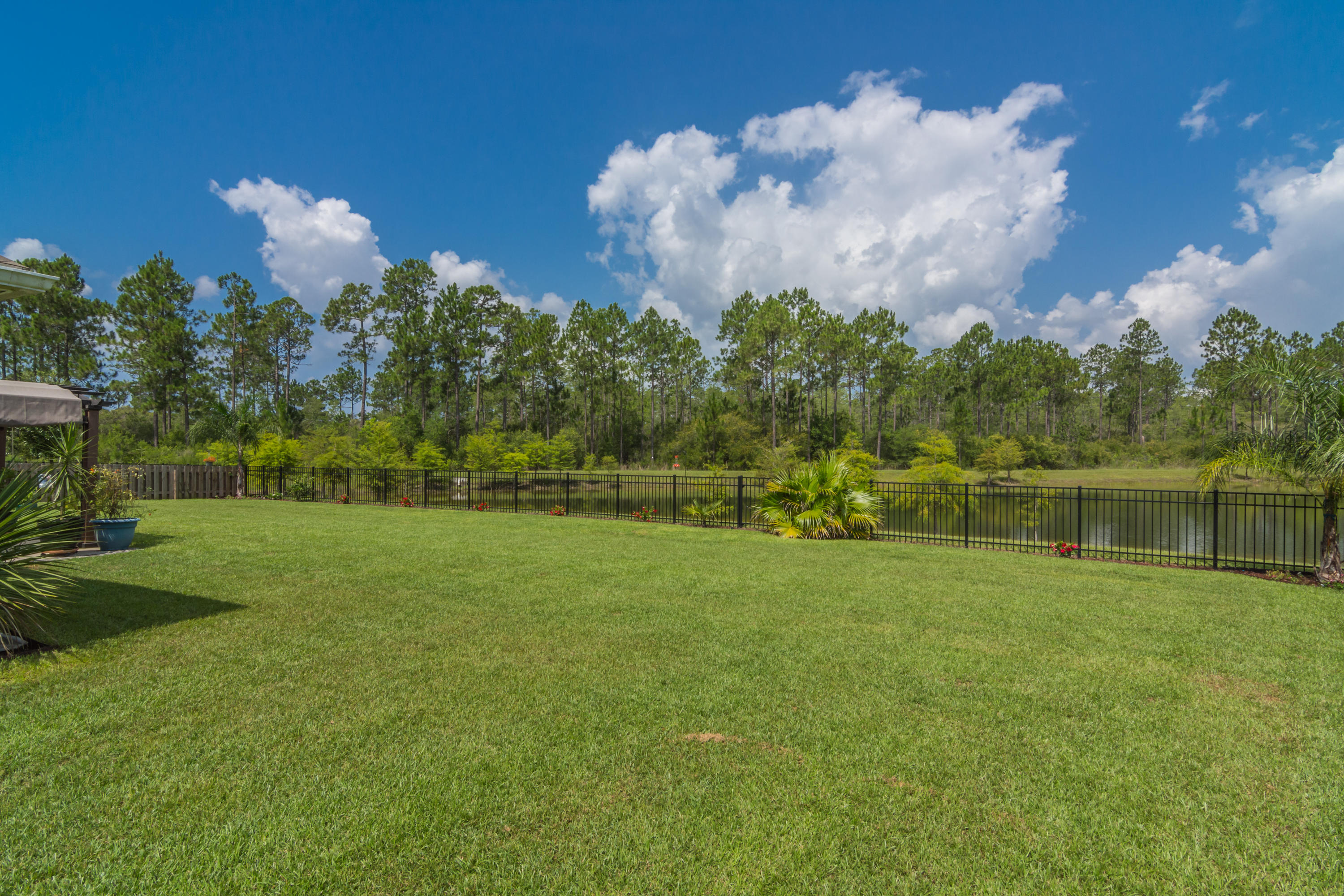 341 Lilly Bell Lane Freeport, FL 32439 - Photo 32 of 36 a view of a golf course with a lake