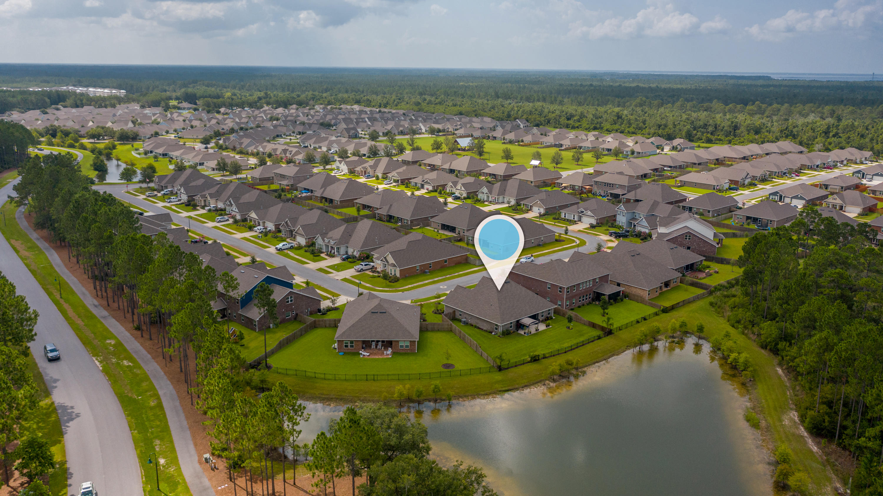 341 Lilly Bell Lane Freeport, FL 32439 - Photo 35 of 36 a view of a lake in a city