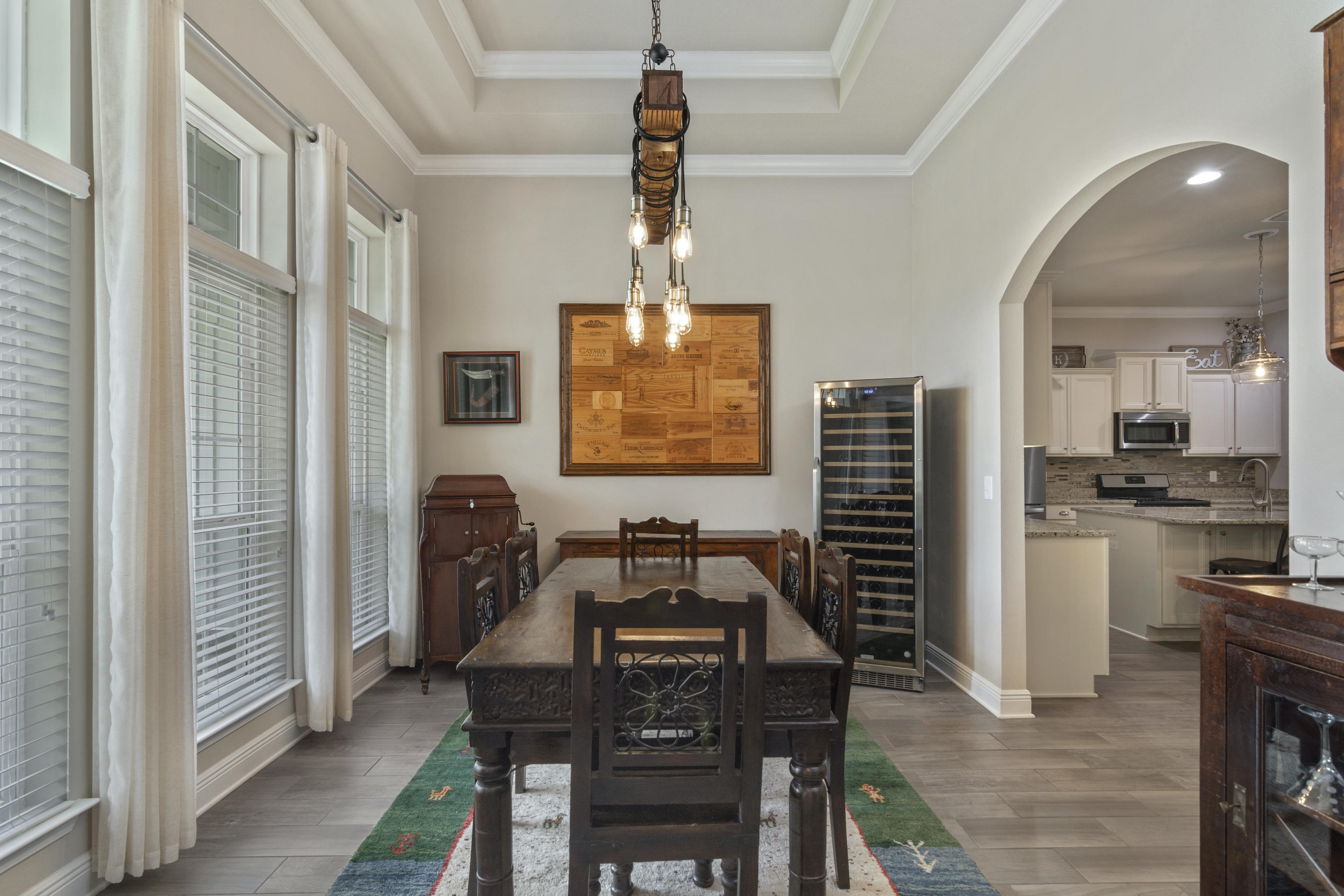 341 Lilly Bell Lane Freeport, FL 32439 - Photo 6 of 36 a dining room with furniture a chandelier a kitchen view and a chandelier