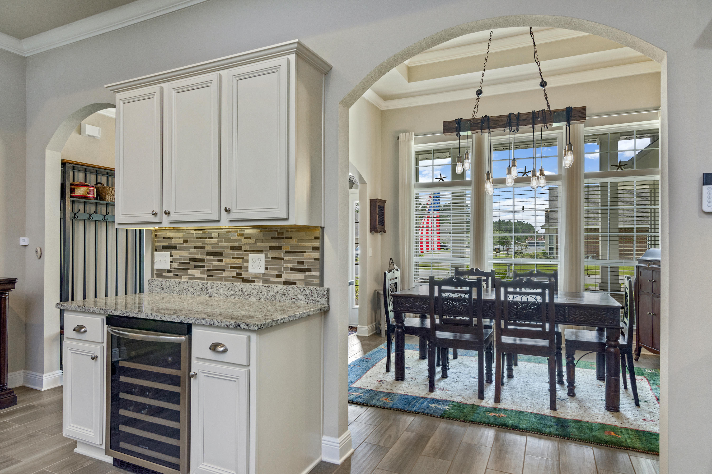 341 Lilly Bell Lane Freeport, FL 32439 - Photo 10 of 36 a dining table chair next to a window