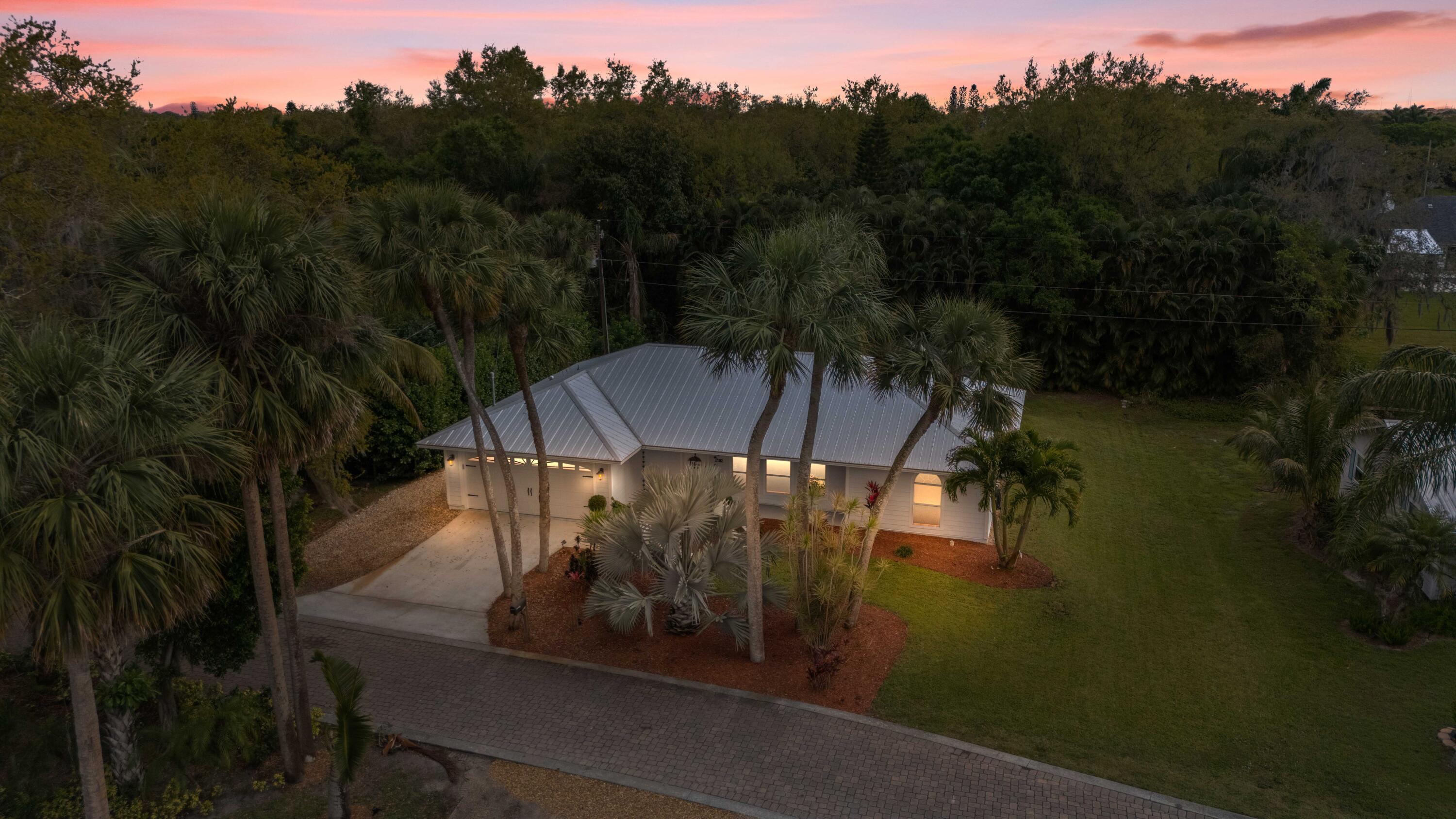542 Southwest Timber Trail Stuart, FL 34997 - Photo 2 of 28 DJI_20250303142453_0106_D_Twilight