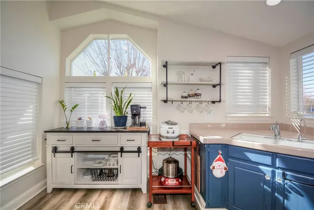a kitchen with a refrigerator and a sink