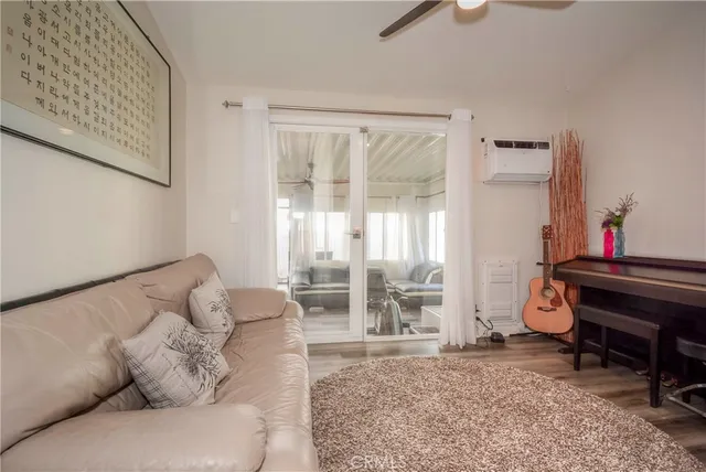 a living room with furniture and a piano