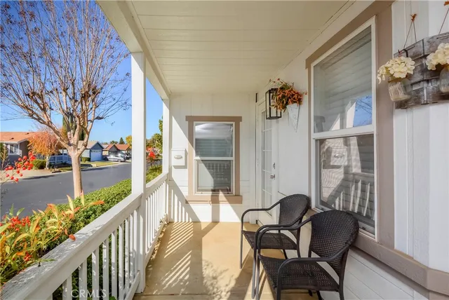 a view of a balcony with furniture