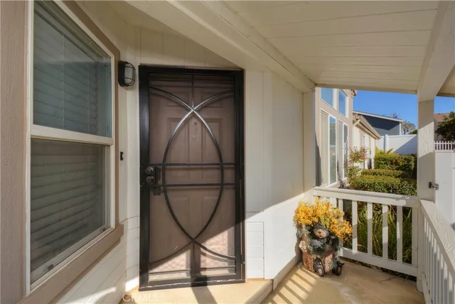 a view of an entryway with wooden floor