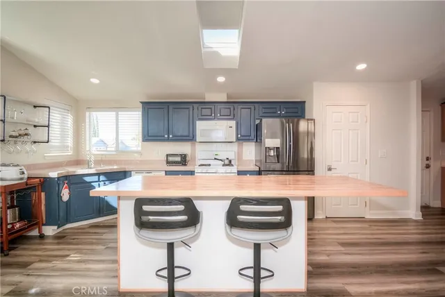 a kitchen with counter space cabinets and appliances