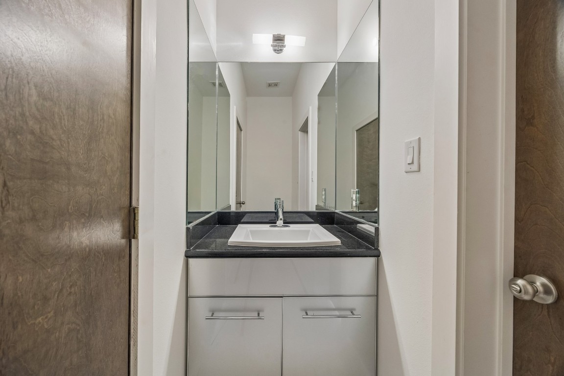 1820 Prospect Street Houston, TX 77004 - Photo 11 of 17 a bathroom with a sink and a mirror