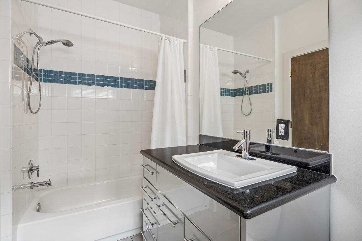 1820 Prospect Street Houston, TX 77004 - Photo 16 of 17 a bathroom with a sink and a mirror
