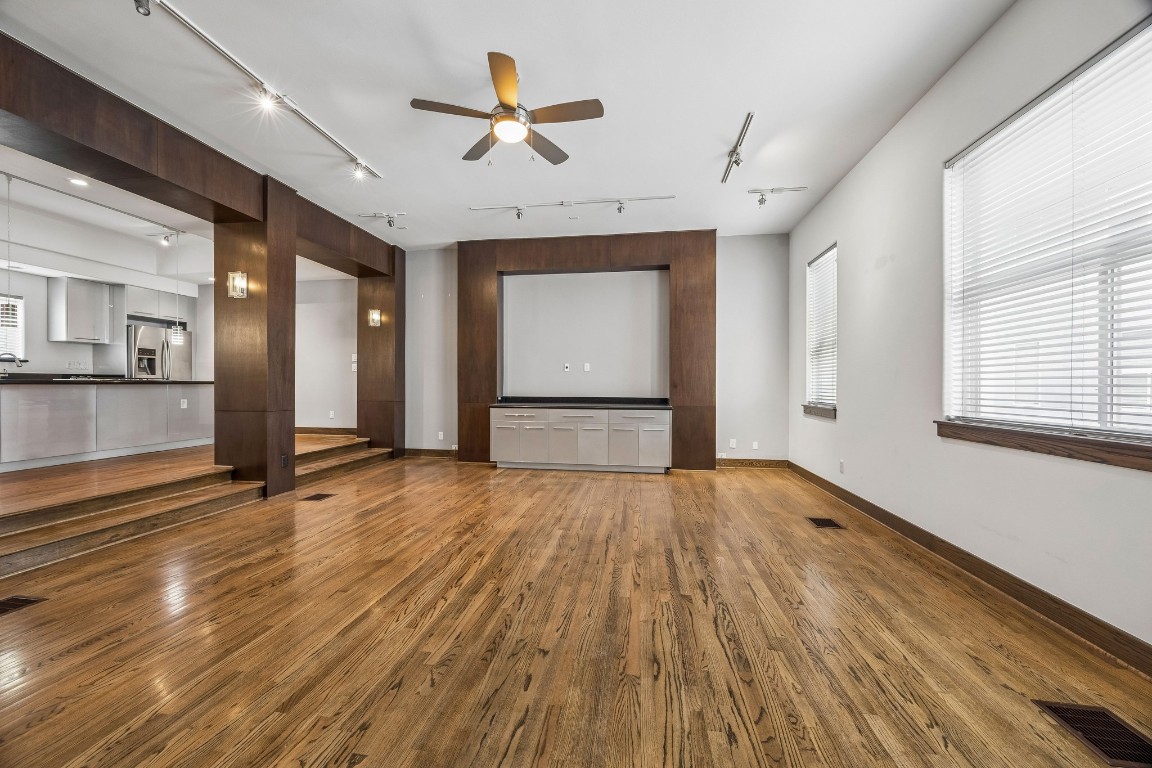1820 Prospect Street Houston, TX 77004 - Photo 2 of 17 a view of empty room with wooden floor and fan