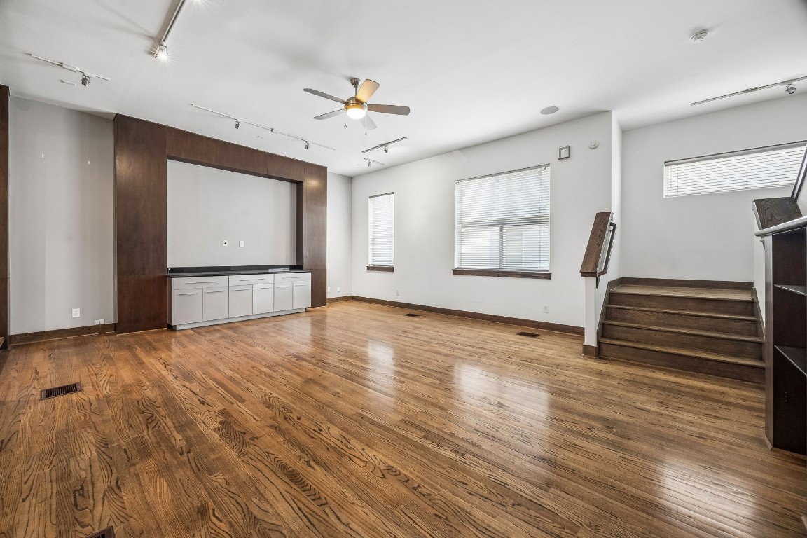 1820 Prospect Street Houston, TX 77004 - Photo 3 of 17 an empty room with wooden floor and windows