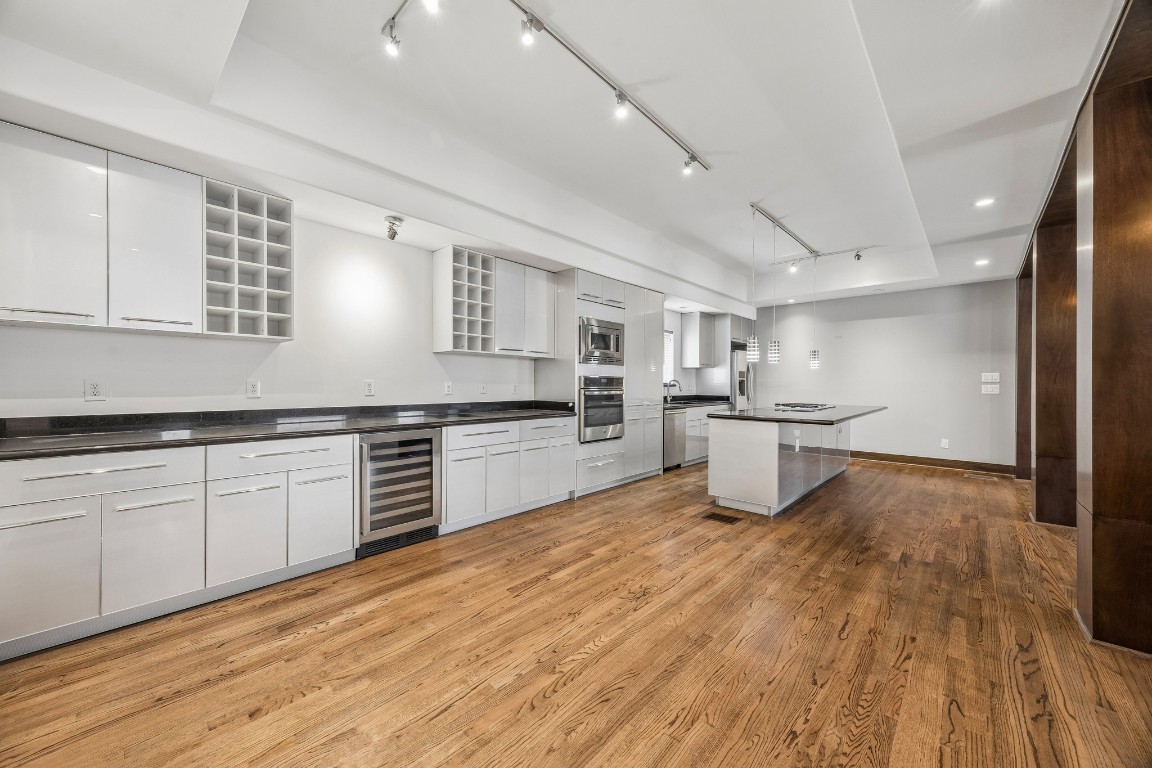 1820 Prospect Street Houston, TX 77004 - Photo 4 of 17 a kitchen with white cabinets and white appliances