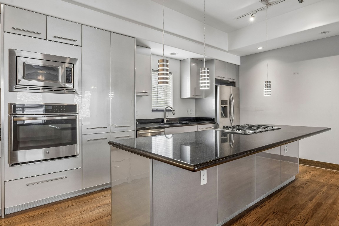 1820 Prospect Street Houston, TX 77004 - Photo 6 of 17 a kitchen with stainless steel appliances granite countertop a stove and a refrigerator
