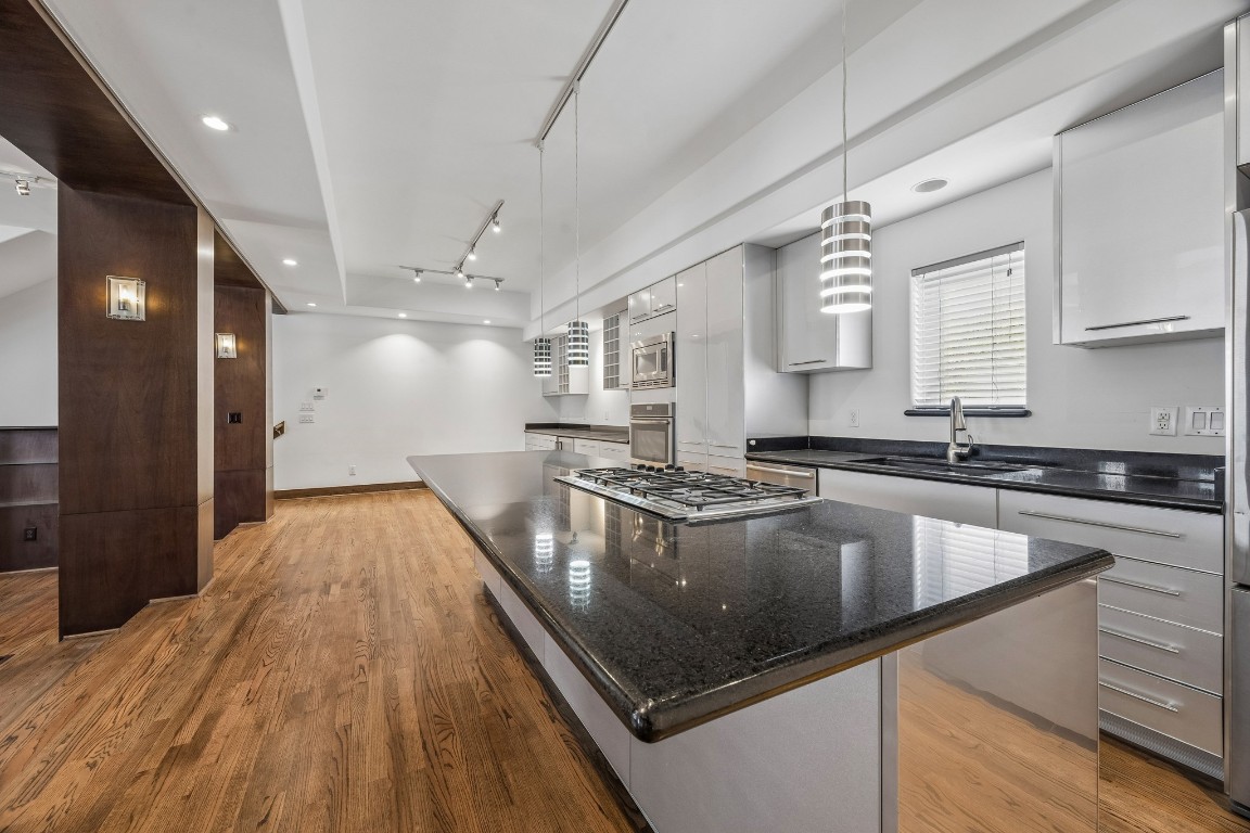 1820 Prospect Street Houston, TX 77004 - Photo 7 of 17 a large kitchen with stainless steel appliances granite countertop a lot of counter space and a sink