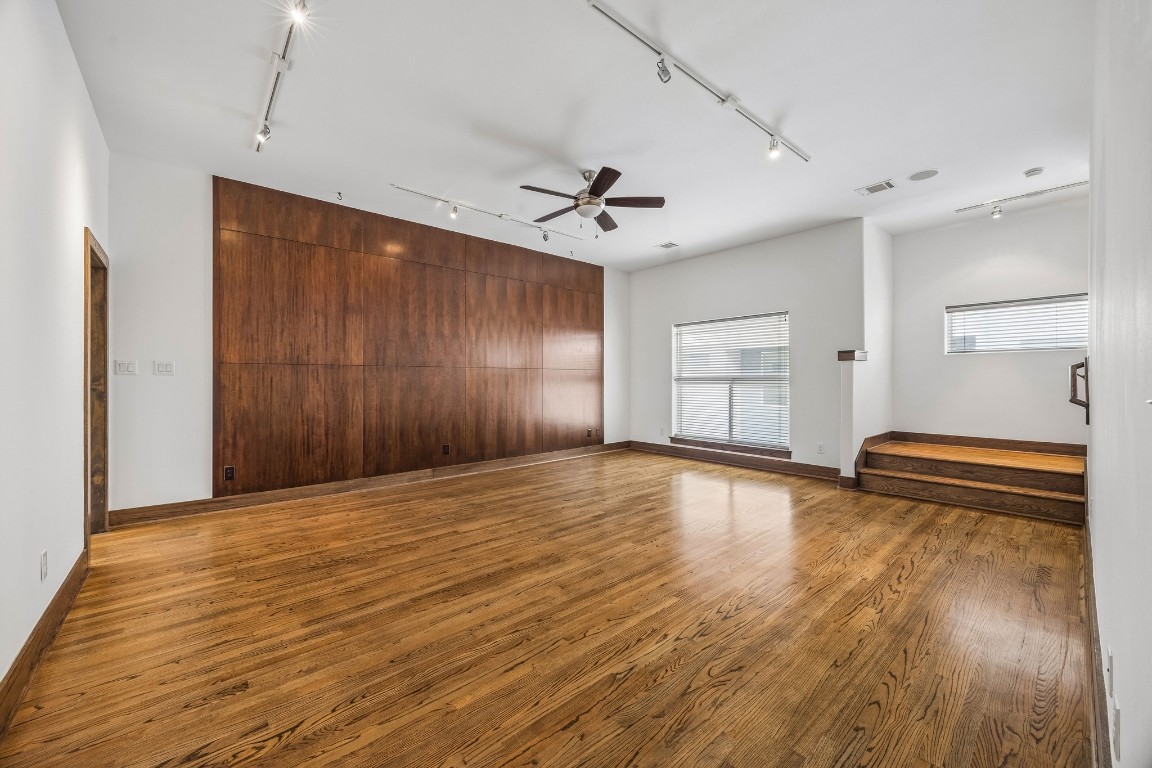 1820 Prospect Street Houston, TX 77004 - Photo 8 of 17 a view of empty room with wooden floor and fan