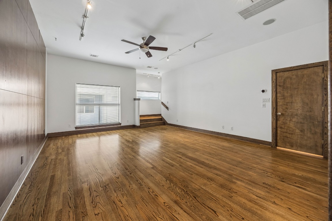 1820 Prospect Street Houston, TX 77004 - Photo 9 of 17 a view of empty room with wooden floor and fan