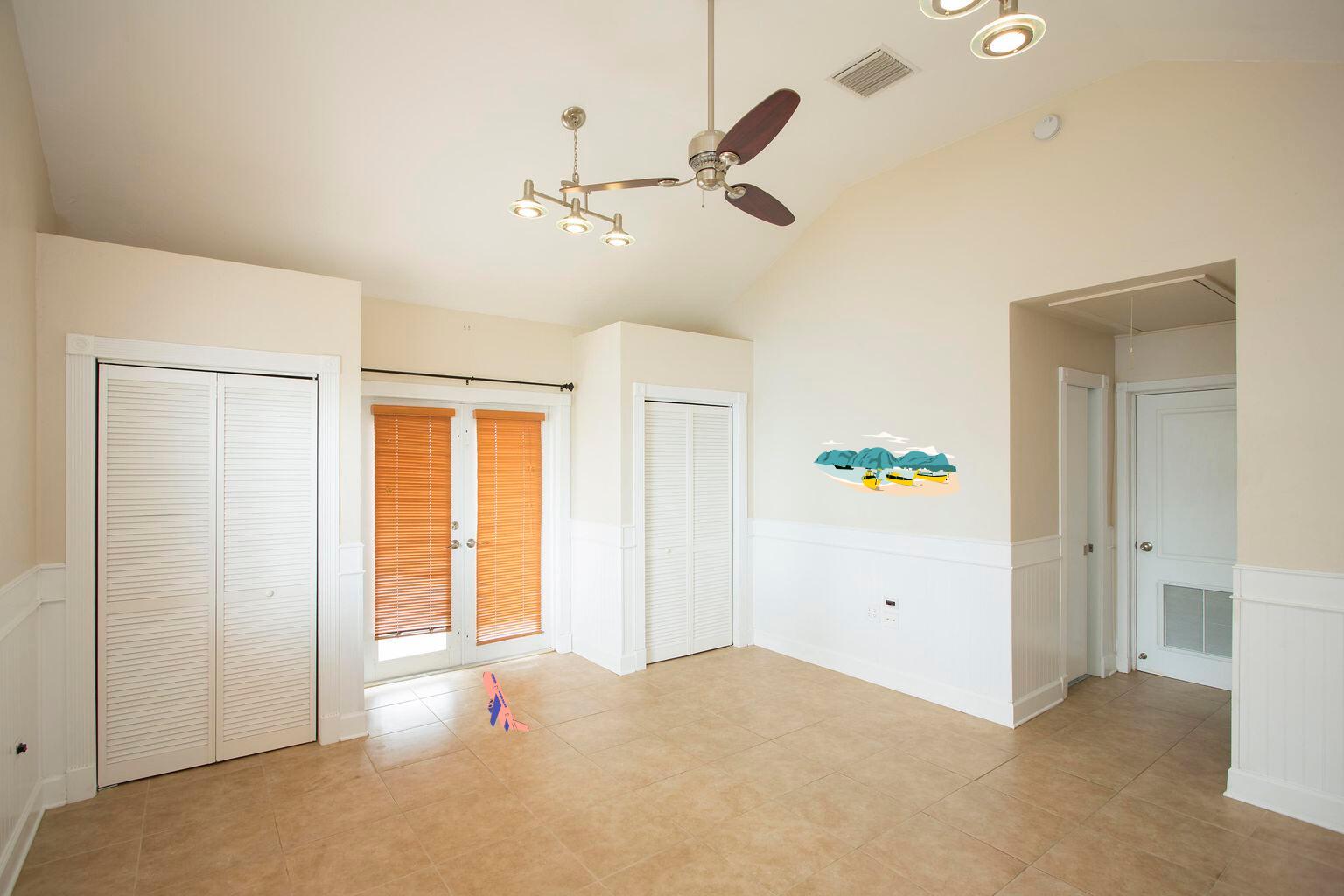 2311 Patterson Avenue Key West, FL 33040 - Photo 15 of 39 an empty room with a ceiling fan and a window