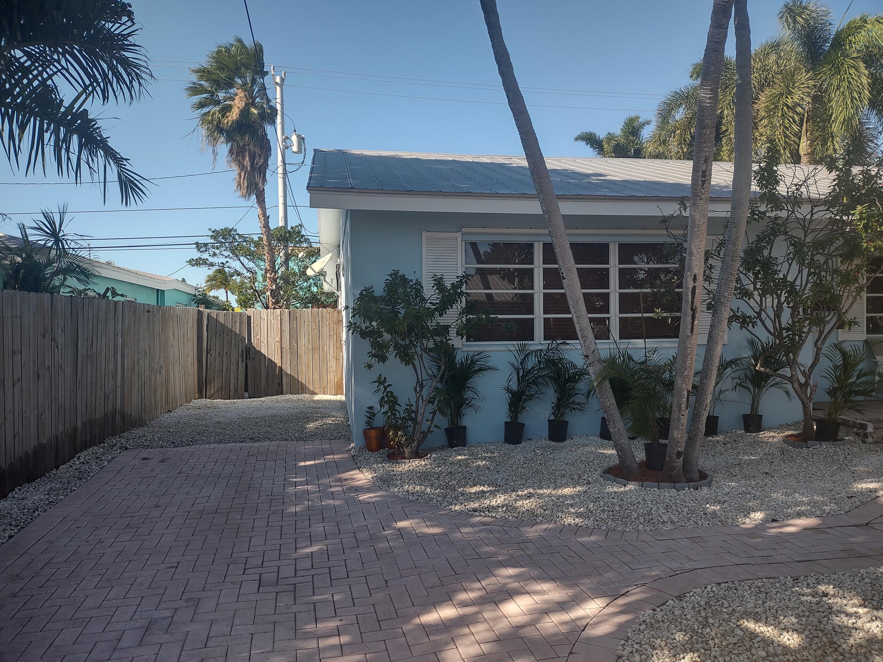 2311 Patterson Avenue Key West, FL 33040 - Photo 32 of 39 a front view of a house with a yard