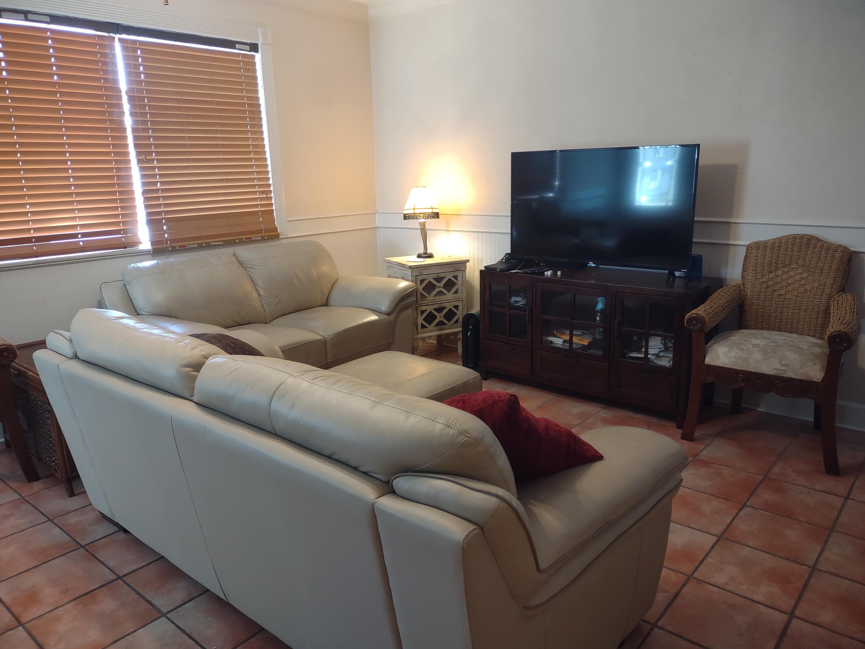 2311 Patterson Avenue Key West, FL 33040 - Photo 34 of 39 a living room with furniture and a flat screen tv