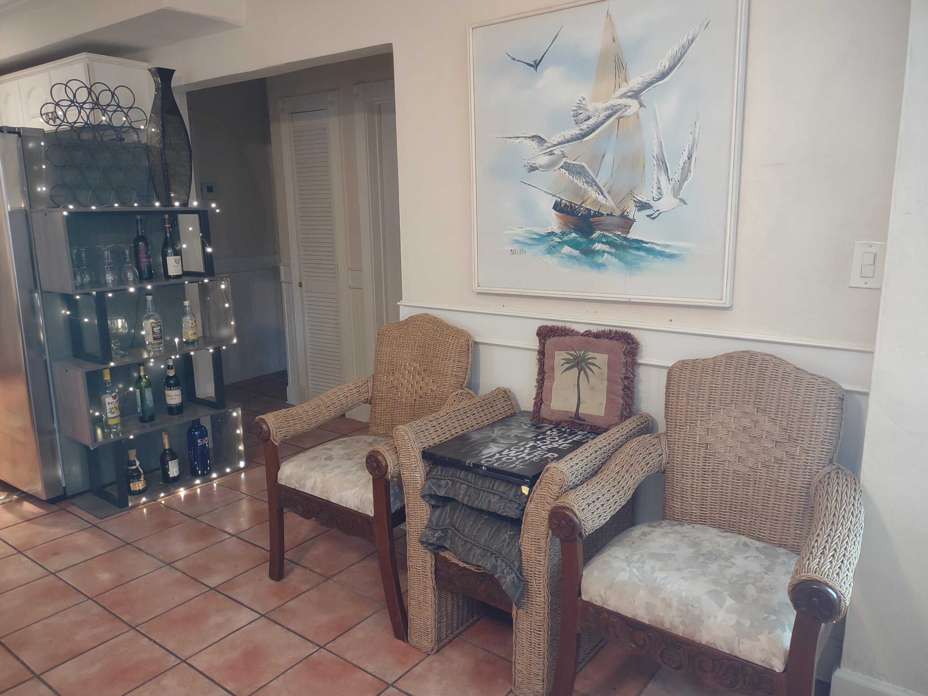 2311 Patterson Avenue Key West, FL 33040 - Photo 35 of 39 a view of a dining room with furniture and chandelier