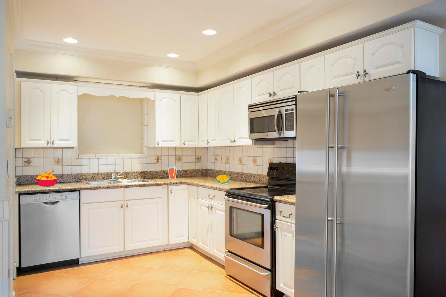 2311 Patterson Avenue Key West, FL 33040 - Photo 9 of 39 a kitchen with a sink stainless steel appliances and white cabinets