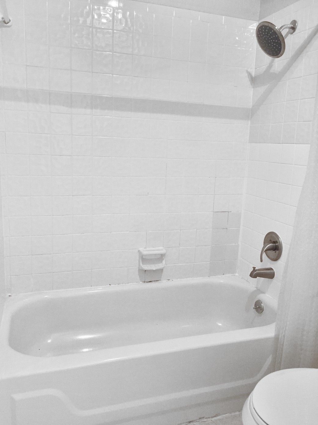 807 West 25th Street, Unit 312 Austin, TX 78705 - Photo 11 of 15 Bathroom featuring toilet and shower / bath combo with shower curtain