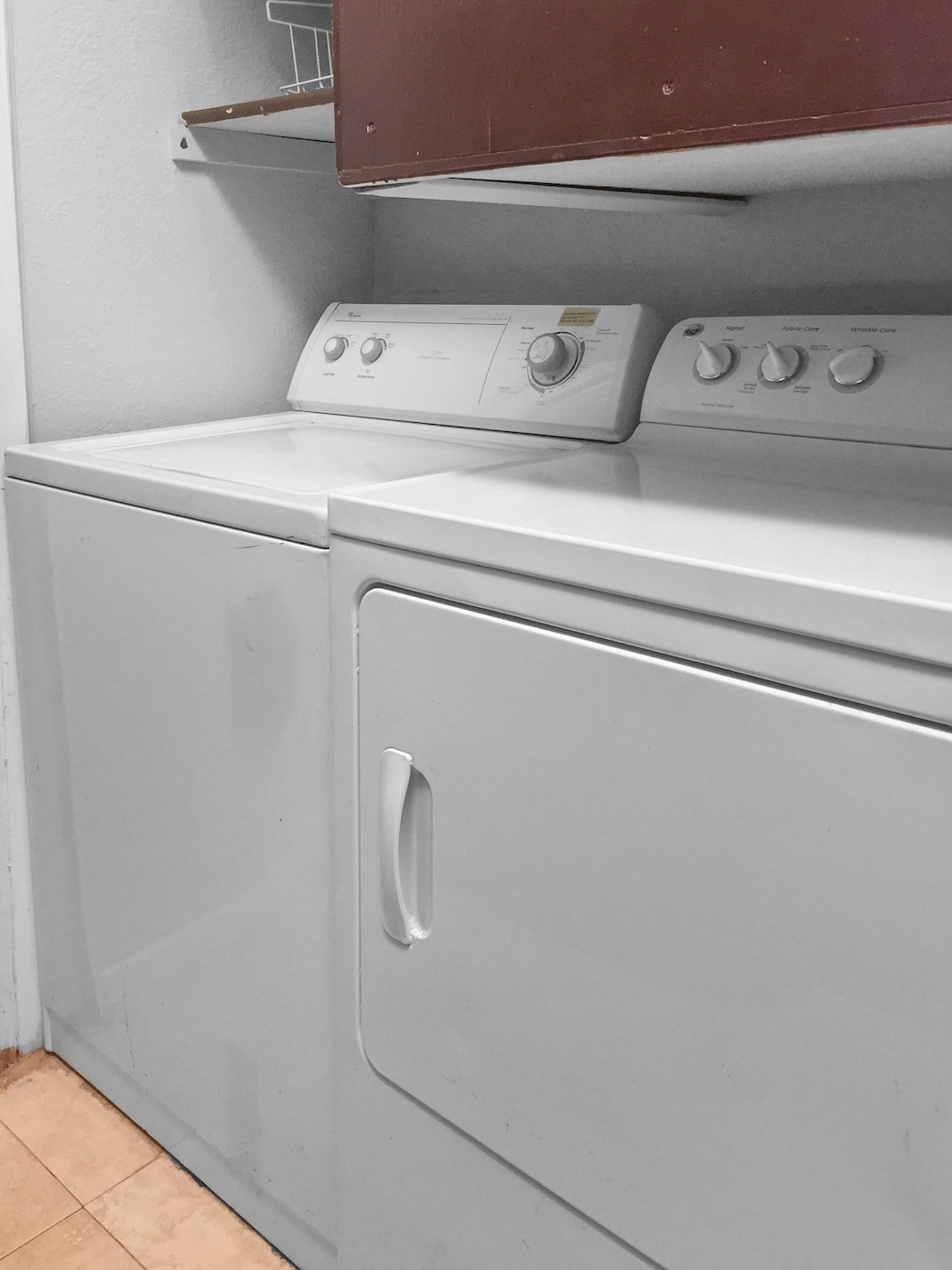 807 West 25th Street, Unit 312 Austin, TX 78705 - Photo 7 of 15 Laundry area with washing machine and clothes dryer and light tile patterned flooring