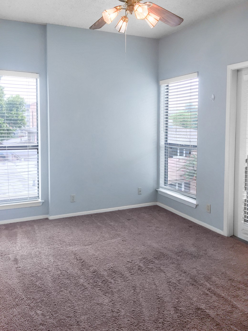 807 West 25th Street, Unit 312 Austin, TX 78705 - Photo 8 of 15 Unfurnished room with ceiling fan and dark colored carpet