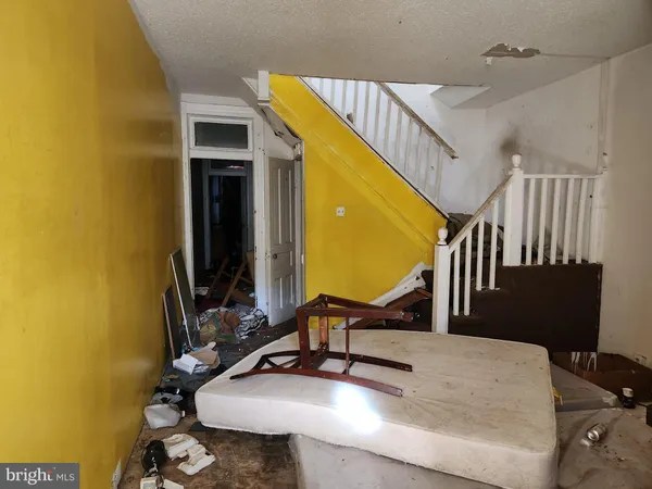 a view of a living room with bathroom