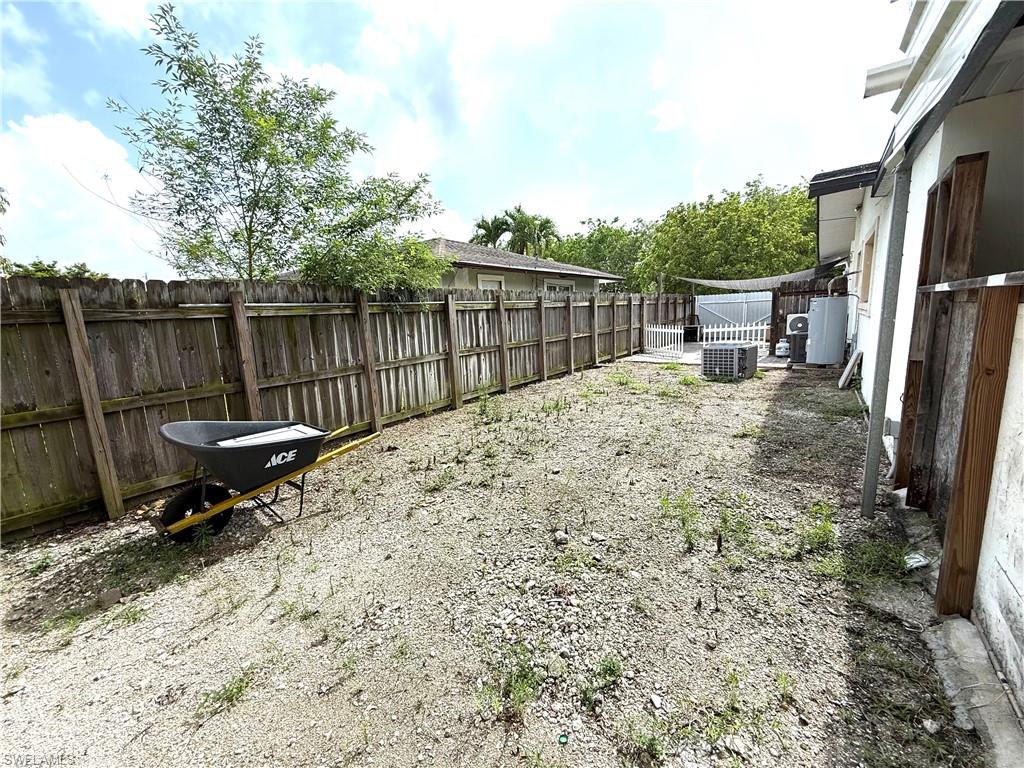 1964 42nd Street Southwest Naples, FL 34116 - Photo 22 of 25 a garden view with a seating space
