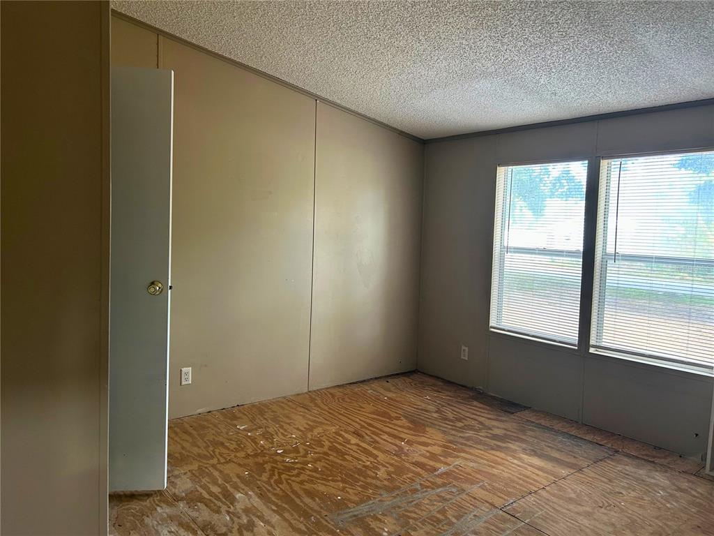 9867 Jerome Drive New Port Richey, FL 34654 - Photo 24 of 30 a view of an empty room and window
