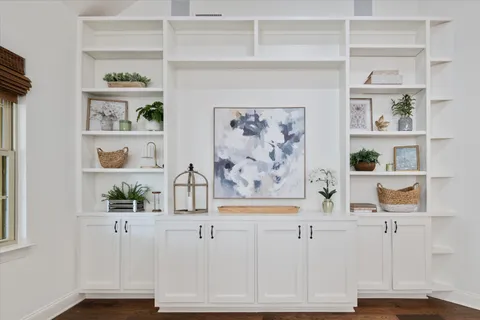 a view of kitchen with cabinets and wooden floor