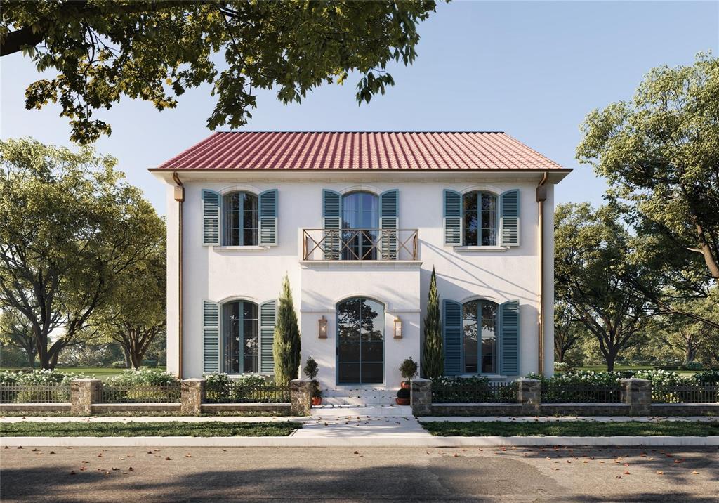 a front view of a house with a tree
