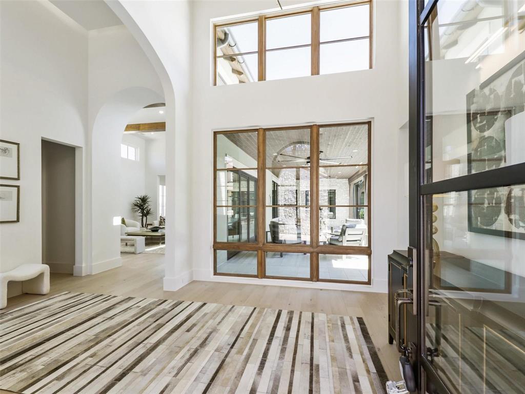 1824 Riviera Lane Southlake, TX 76092 - Photo 3 of 11 a view of a living room and a balcony with wooden floor
