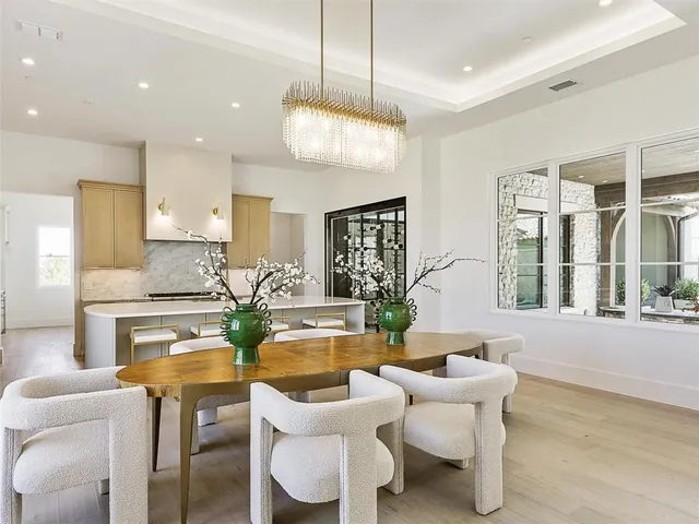 a living room with fireplace furniture and a wooden floor