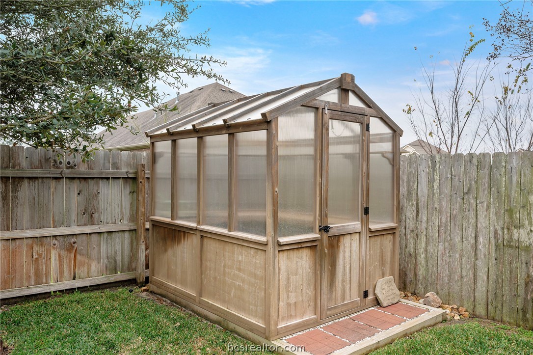 3085 Archer Circle Bryan, TX 77808 - Photo 28 of 32 Custom greenhouse provides convenience for growing and caring for plants.
