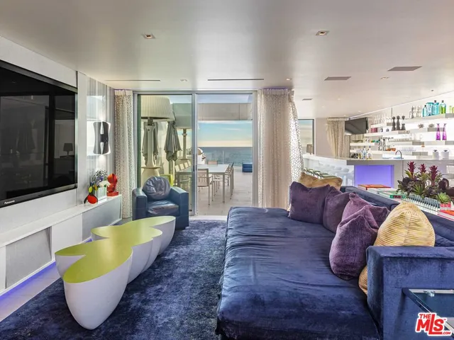 a kitchen with stainless steel appliances kitchen island granite countertop a sink and cabinets