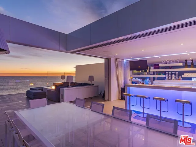 a living room with furniture a fireplace and a table