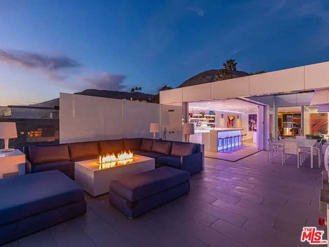 a view of swimming pool with seating area
