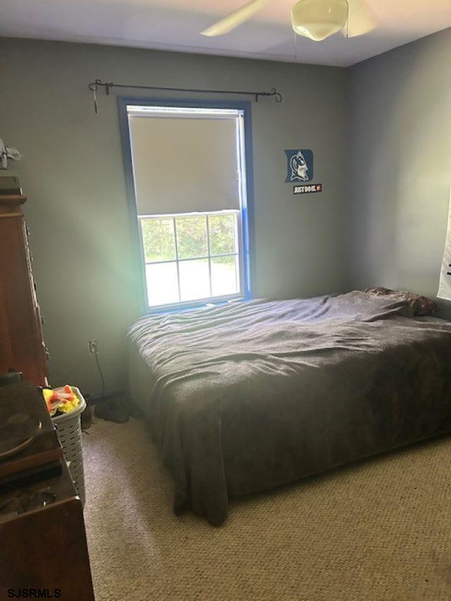 120 Head Of River Road Corbin City, NJ 08270 - Photo 12 of 19 a bedroom with a bed and a window