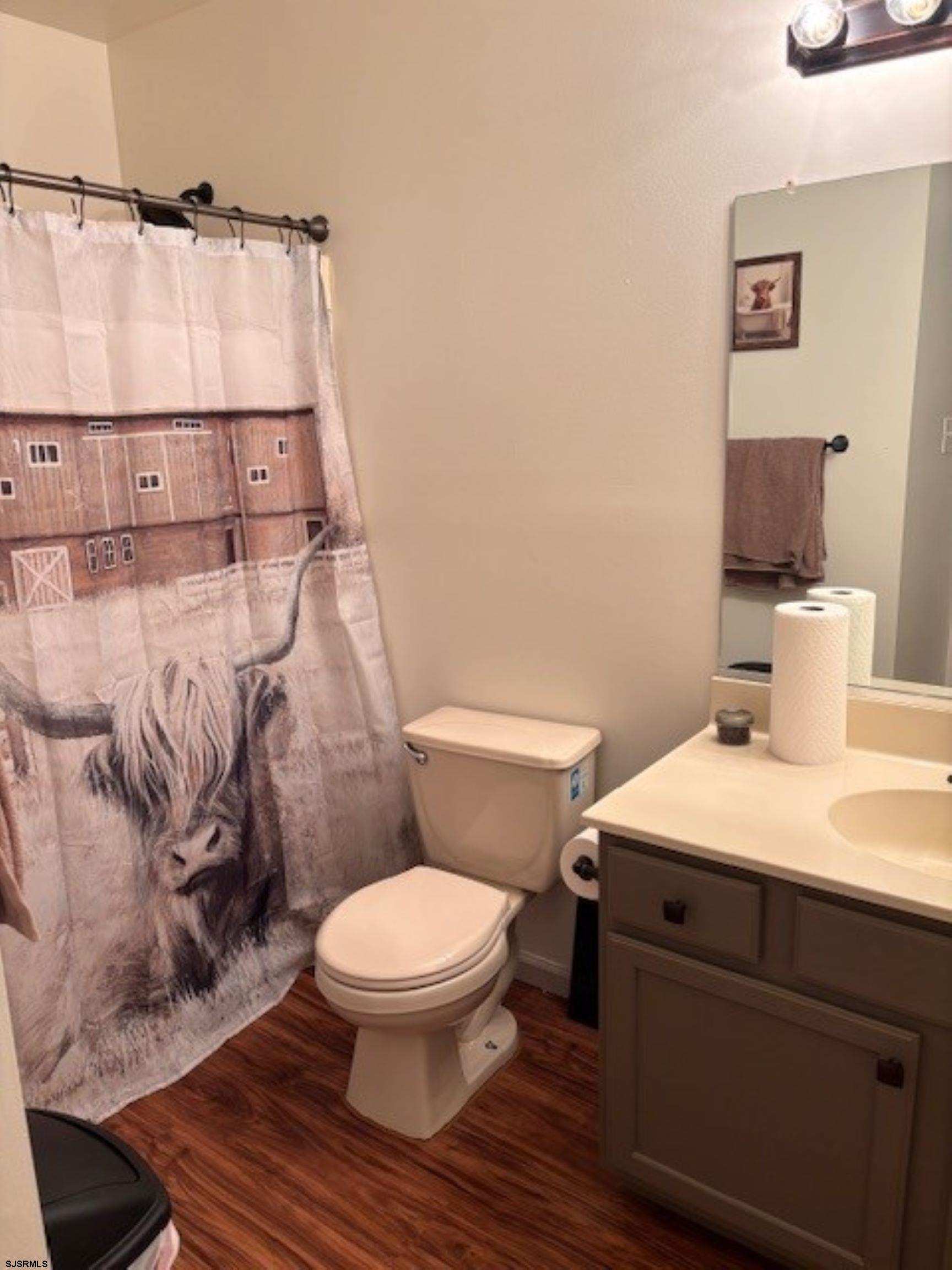 120 Head Of River Road Corbin City, NJ 08270 - Photo 2 of 19 a white toilet sitting next to a bathroom sink