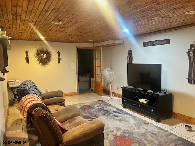 120 Head Of River Road Corbin City, NJ 08270 - Photo 9 of 19 a living room with furniture and a flat screen tv