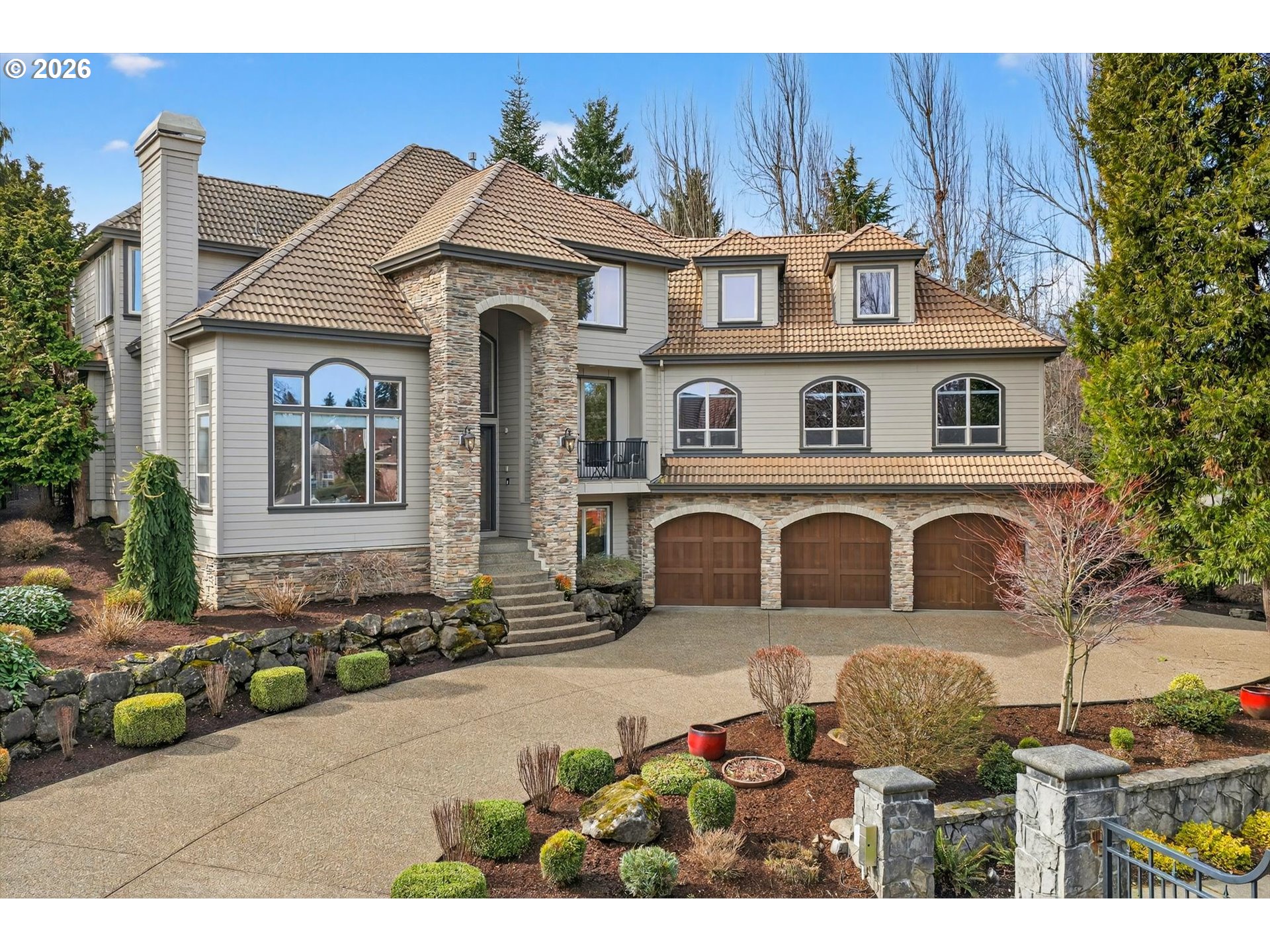 a front view of a house with garden