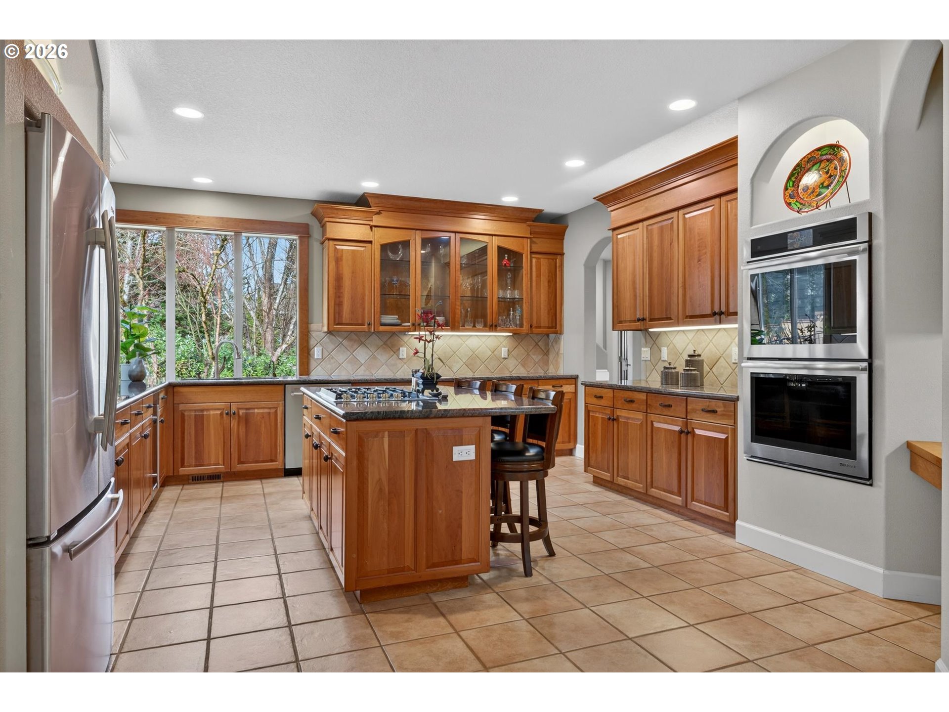 3390 Quail Ridge Court West Linn, OR 97068 - Photo 14 of 48 a open kitchen with granite countertop a stove top oven a sink a counter space and cabinets