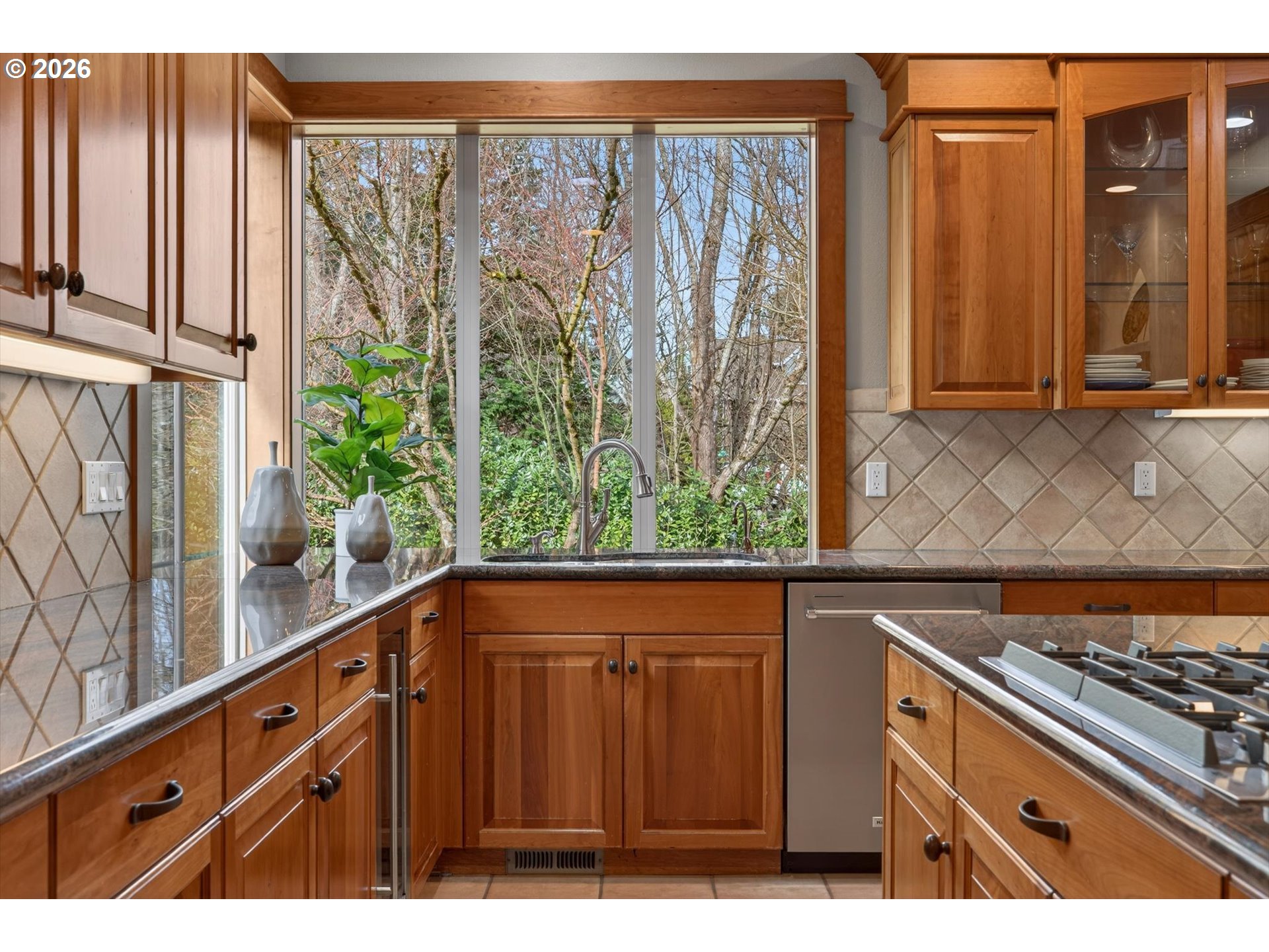 3390 Quail Ridge Court West Linn, OR 97068 - Photo 16 of 48 a view of a kitchen with wooden floor and a window