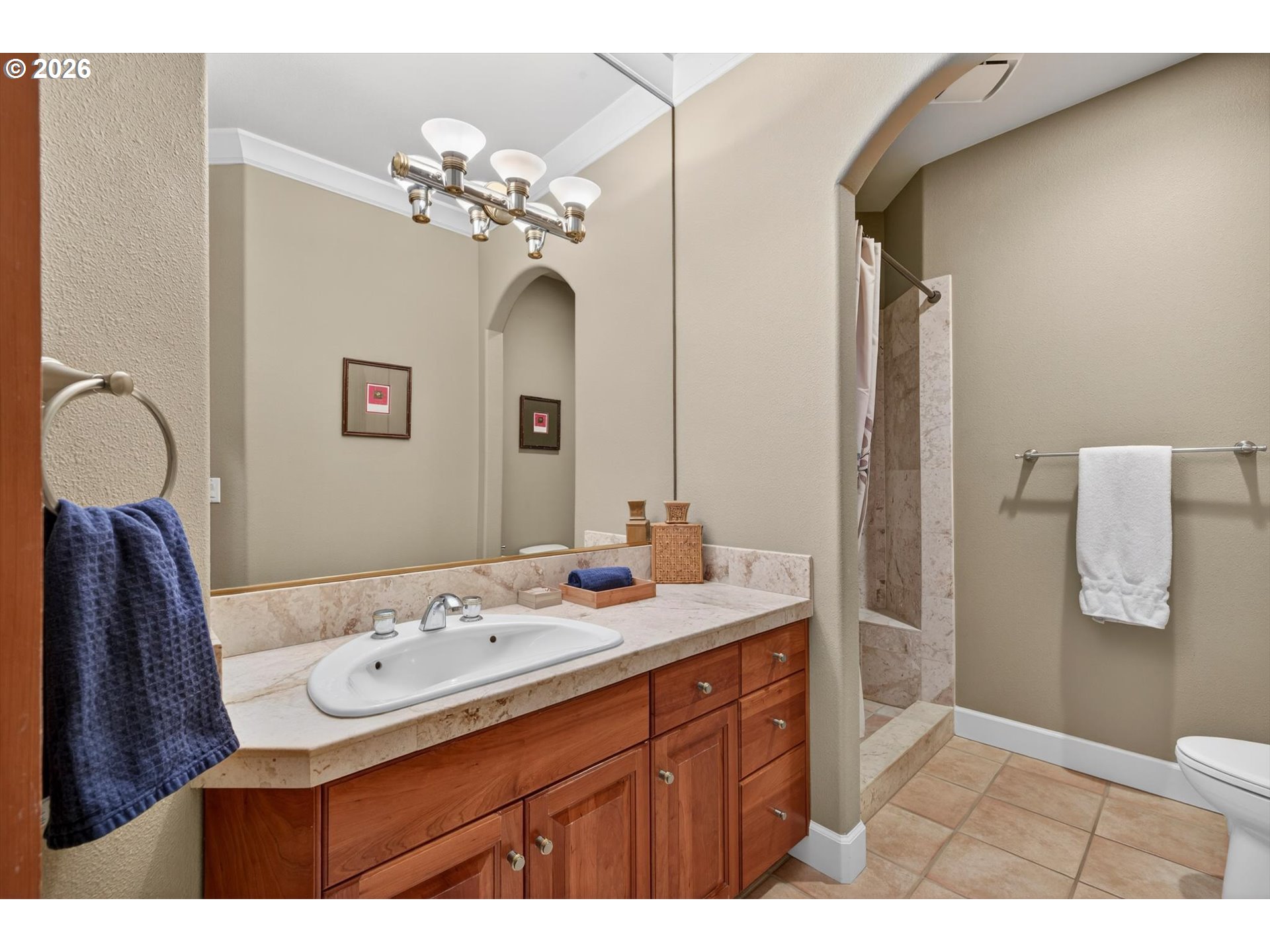 3390 Quail Ridge Court West Linn, OR 97068 - Photo 23 of 48 a bathroom with a sink vanity granite and a mirror